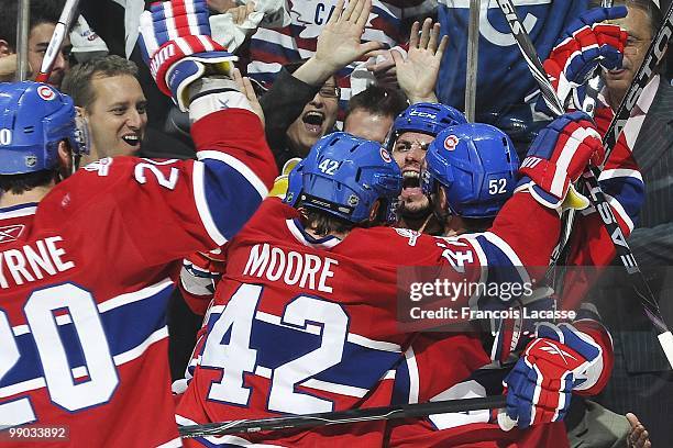 Maxim Lapierre of Montreal Canadiens celebrates his goal with teammate Dominic Moore in Game Four of the Eastern Conference Semifinals against the...