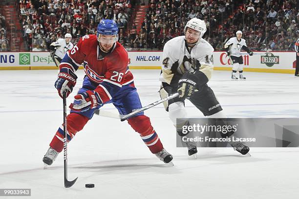 Josh Gorges of Montreal Canadiens skates with the puck in front of Chris Kunitz of the Pittsburgh Penguins in Game Four of the Eastern Conference...