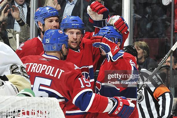 Travis Moen of Montreal Canadiens celebrates a goal with teammate Glen Metropolit in Game Four of the Eastern Conference Semifinals against the...