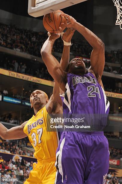 Carl Landry of the Sacramento Kings drives the ball against Ron Artest of the Los Angeles Lakers at Staples Center on April 13, 2010 in Los Angeles,...