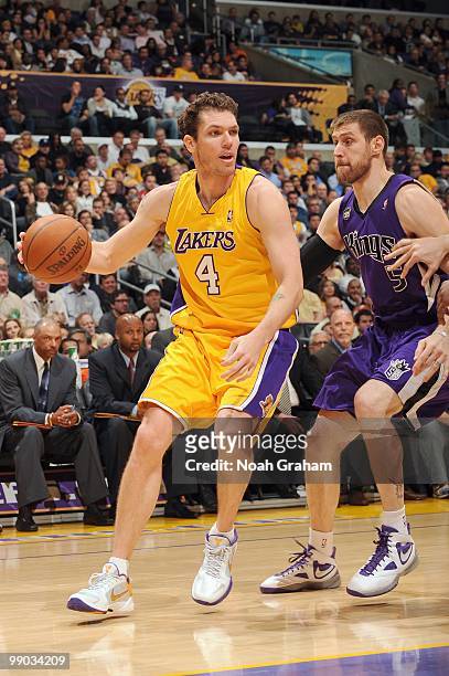 Luke Walton of the Los Angeles Lakers drives the ball against Andres Nocioni of the Sacramento Kings at Staples Center on April 13, 2010 in Los...
