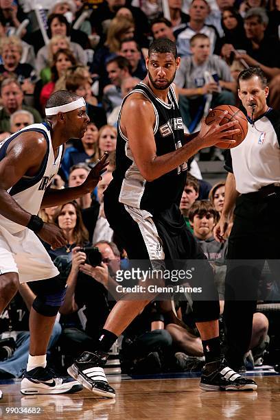 Tim Duncan of the San Antonio Spurs goes up against Erick Dampier of the Dallas Mavericks in Game Five of the Western Conference Quarterfinals during...