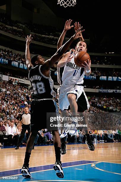 Jose Barea of the Dallas Mavericks lays the ball up over Ian Mahinmi of the San Antonio Spurs in Game Five of the Western Conference Quarterfinals...