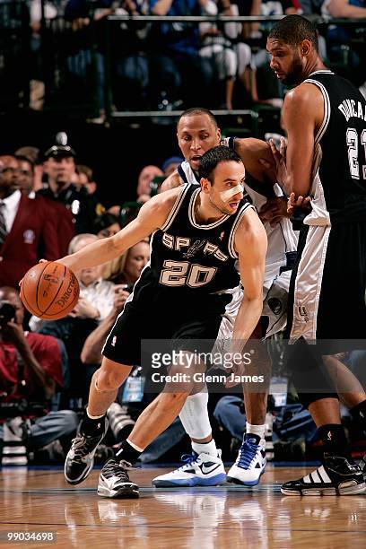 Manu Ginobili of the San Antonio Spurs drives around Shawn Marion of the Dallas Mavericks in Game Five of the Western Conference Quarterfinals during...