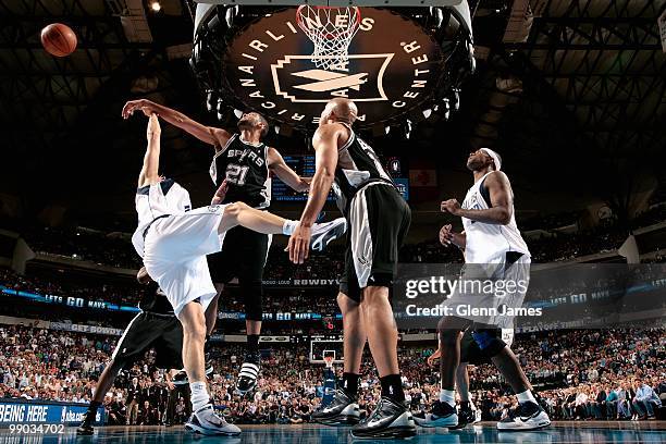 Tim Duncan of the San Antonio Spurs knocks the ball away from Dirk Nowitzki of the Dallas Mavericks in Game Five of the Western Conference...