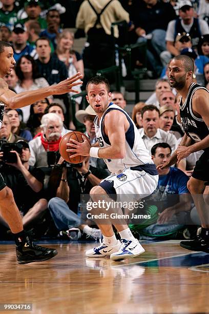 Jose Barea of the Dallas Mavericks handles the ball under pressure from George Hill and Tony Parker of the San Antonio Spurs in Game Five of the...