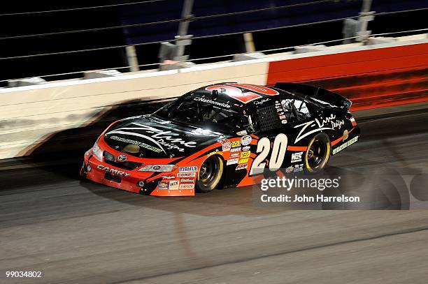 Denny Hamlin, driver of the Z-Line Designs / Operations Helmet Toyota, races during the NASCAR Nationwide series Royal Purple 200 presented by...