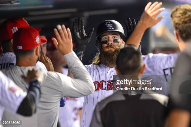 Charlie Blackmon of the Colorado Rockies celebrates a go-ahead run in the seventh inning of a game against the San Francisco Giants at Coors Field on...