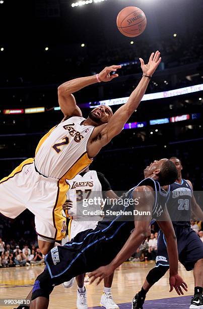 Derek Fisher of the Los Angeles Lakers runs into C.J. Miles of the Utah Jazz during Game One of the Western Conference Semifinals of the 2010 NBA...