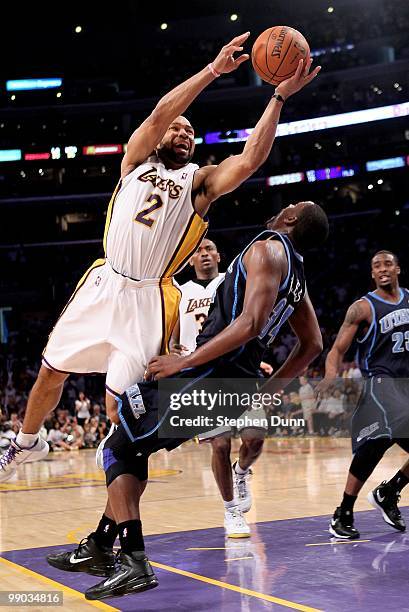 Derek Fisher of the Los Angeles Lakers runs into C.J. Miles of the Utah Jazz during Game One of the Western Conference Semifinals of the 2010 NBA...