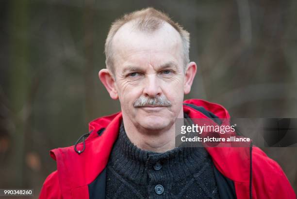 Public veterinarian Dr. Hans-Helmut Jostmeyer seen during a driven hunt across a forest near the motorway A2 in Bielefeld, Germany, 09 January 2018....