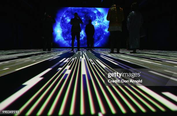 People view Ryoji Ikeda's latest installation 'Micro | Macro' at Carriageworks on July 3, 2018 in Sydney, Australia.