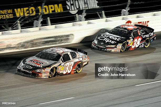 Kevin Harvick, driver of the Rheem Ruud Chevrolet, leads Kasey Kahne, driver of the Great Clips Toyota, during the NASCAR Nationwide series Royal...