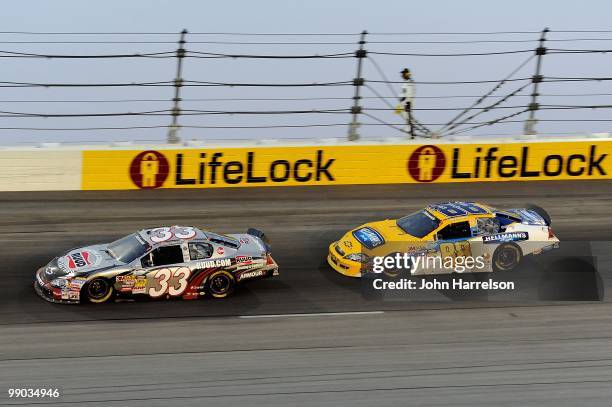 Kevin Harvick, driver of the Rheem Ruud Chevrolet, leads Jamie McMurray, driver of the Hellmann's Chevrolt, during the NASCAR Nationwide series Royal...