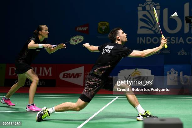 Mathias Christiansen and Christinna Pedersen of Denmark compete against Sam Magee and Chloe Magee of Ireland during Mixed Doubles Round 1 on day one...