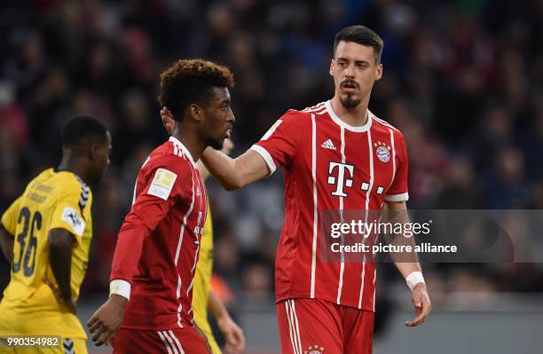 Munich's Sandro Wagner congratulating Kingsley Coman on his 1-0 goal during the soccer friendly match between FC Bayern Munich and SG Sonnenhof...