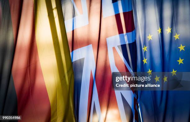 German , a British and a EU flag hanging at the production site of the subsidiary company of a British company in Offenbach, Germany, 09 January...