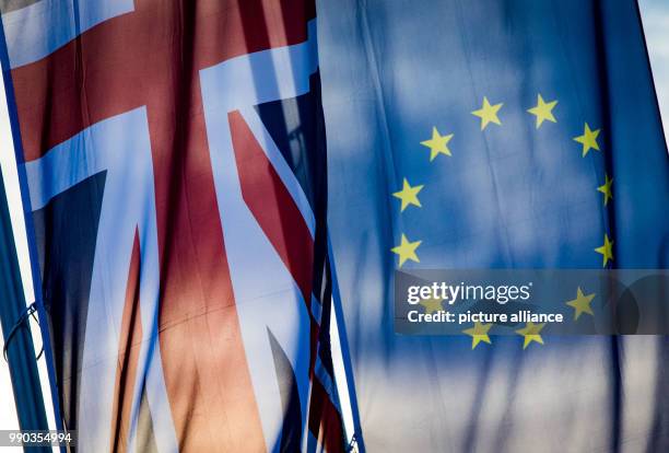 British and a EU flag hanging at the production site of the subsidiary company of a British company in Offenbach, Germany, 09 January 2018. EU...