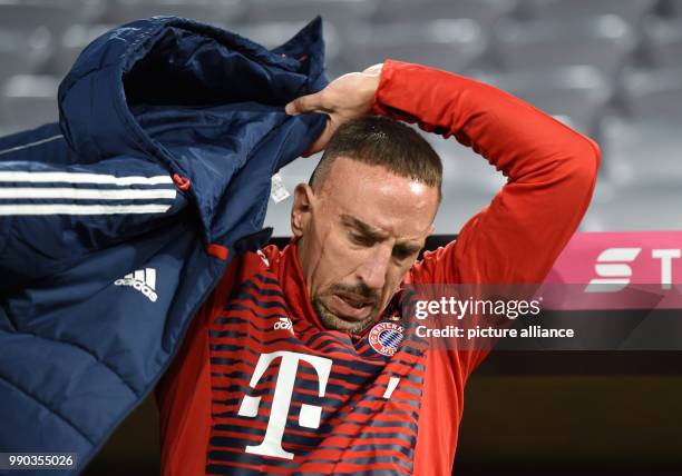 Munich's Franck Ribery putting on a jacket before the soccer friendly match between FC Bayern Munich and SG Sonnenhof Grossaspach at the Allianz...