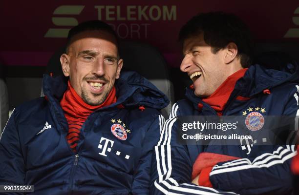 Munich's Franck Ribery and Thomas Mueller sitting on the bench before the soccer friendly match between FC Bayern Munich and SG Sonnenhof Grossaspach...