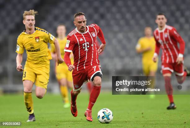 Munich's Franck Ribery and Grossaspach's Nico Gutjahr vie for the ball during the soccer friendly match between FC Bayern Munich and SG Sonnenhof...