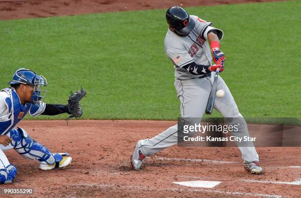 Cleveland Indians' Edwin Encarnacion connects on a sacrifice fly in the third inning to score Francisco Lindor during Monday's baseball game against...