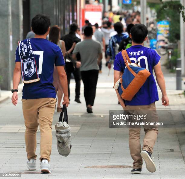 Japanese walk on the street after watching the FIFA World Cup round of 16 match against Belgium on July 3, 2018 in Nagoya, Aichi, Japan.