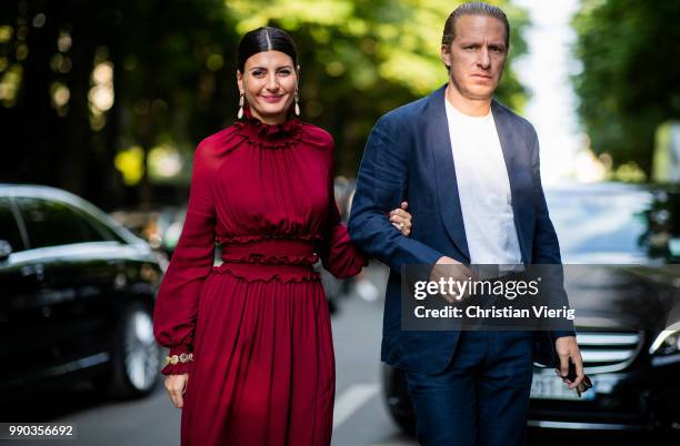 Couple Giovanna Battaglia and Oscar Engelbert is seen outside Giambattista Valli on day two during Paris Fashion Week Haute Couture FW18 on July 2,...