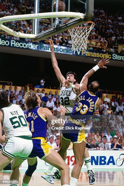 Kevin McHale of the Boston Celtics shoots against Kareem Abdul-Jabbar of the Los Angeles Lakers during the 1987 NBA Finals at the Boston Garden in...