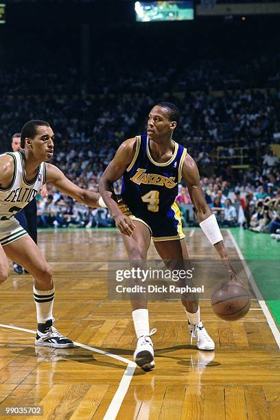 Byron Scott of the Los Angeles Lakers moves the ball up court against Dennis Johnson of the Boston Celtics during the 1987 NBA Finals at the Boston...