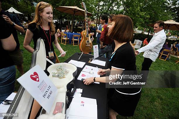 The flood relief donation booth set up by Music Cares is seen at 12th Annual GRAMMY Block Party And Memebership Celebration at Owen Bradley Park on...