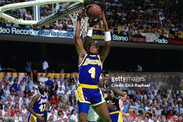 Byron Scott of the Los Angeles Lakers rebounds against the Boston Celtics during the 1987 NBA Finals at the Boston Garden in Boston, Massachusetts....