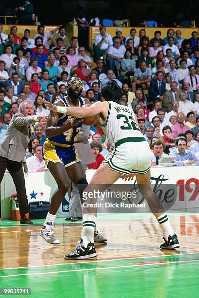 James Worthy of the Los Angeles Lakers looks to make a play against Kevin McHale of the Boston Celtics during the 1987 NBA Finals at the Boston...