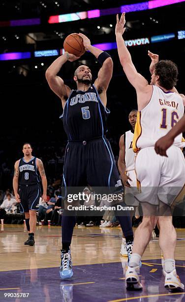 Carlos Boozer of the Utah Jazz shoots over Pau Gasol of the Los Angeles Lakers during Game One of the Western Conference Semifinals of the 2010 NBA...