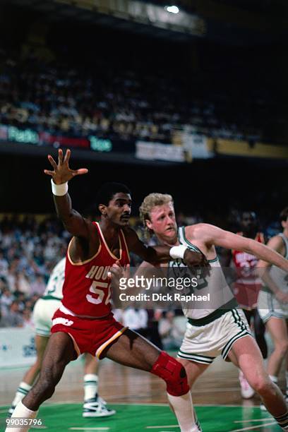 Ralph Sampson of the Houston Rockets posts up against Larry Bird of the Boston Celtics during the 1986 NBA Finals at the Boston Garden in Boston,...
