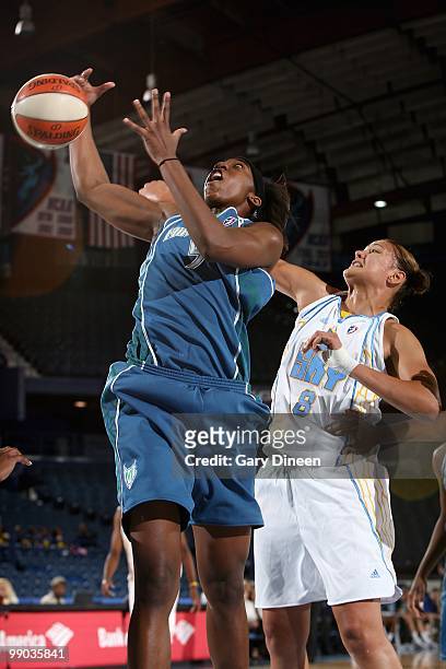 Quanitra Hollingsworth of the Minnesota Lynx goes after a rebound over Mistie Bass of the Chicago Sky during the preseason WNBA game on May 6, 2010...