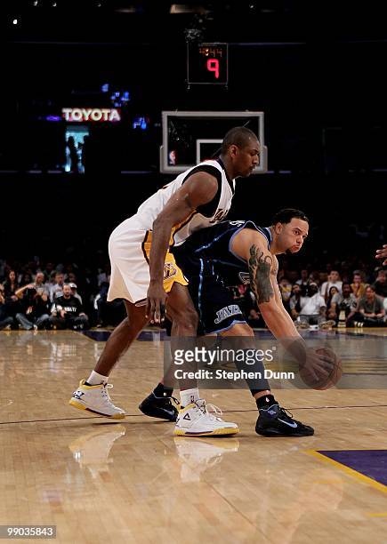 Deron Williams of the Utah Jazz controls the ball against Ron Artest of the Los Angeles Lakers during Game One of the Western Conference Semifinals...