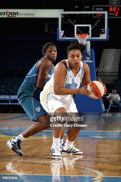 Abi Olajuwon of the Chicago Sky drives past Nicky Anosike of the Minnesota Lynx during the preseason WNBA game on May 6, 2010 at the AllState Arena...