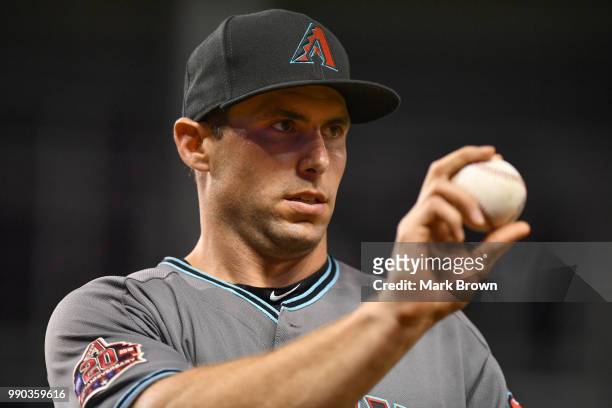 Paul Goldschmidt of the Arizona Diamondbacks looks to throw a ball to a fan during the game against the Miami Marlins at Marlins Park on June 26,...