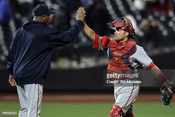Ivan Rodriguez and Livan Hernandez of the Washington Nationals celebrate after defeating the New York Mets on May 10, 2010 at Citi Field in the...