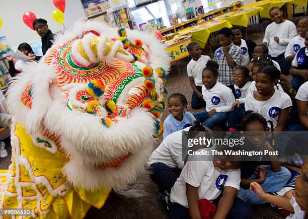 Traditional Chinese lion dancers from The Wong People, in DC entertained the students, although some were scared of it. RIF and Local Students at...