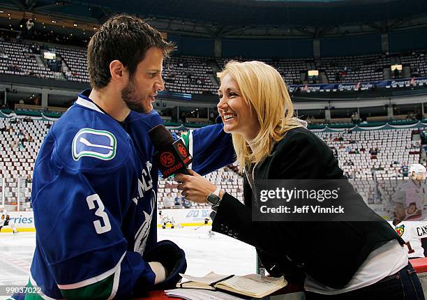 Lindsay Soto of Versus speaks with Kevin Bieksa of the Vancouver Canucks prior to Game 6 of the Western Conference Semifinals during the 2010 Stanley...