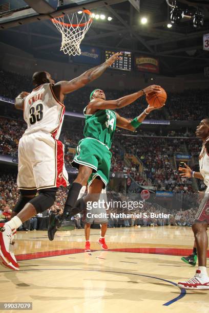 Paul Pierce of the Boston Celtics shoots against Shaquille O'Neal of the Cleveland Cavaliers in Game Five of the Eastern Conference Semifinals during...