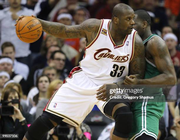 Shaquille O'Neal of the Cleveland Cavaliers tries to get around the defense of Kendrick Perkins of the Boston Celtics in Game Five of the Eastern...