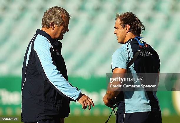 Waratahs coach Chris Hickey talks captain Phil Waugh during a Waratahs Super 14 training session at Sydney Football Stadium on May 12, 2010 in...