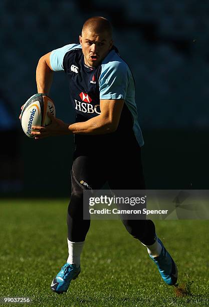 Drew Mitchell of the Waratahs runs the ball during a Waratahs Super 14 training session at Sydney Football Stadium on May 12, 2010 in Sydney,...