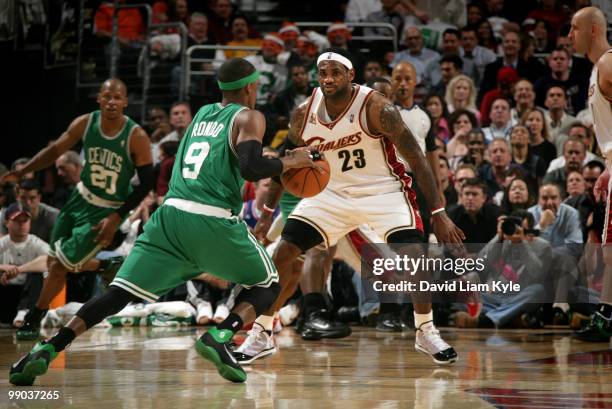 LeBron James of the Cleveland Cavaliers defends a driving Rajon Rondo of the Boston Celtics in Game Five of the Eastern Conference Semifinals during...