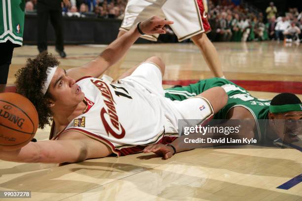 Anderson Varejao of the Cleveland Cavaliers awaits the call from the official after he came away with the loose ball against Paul Pierce of the...