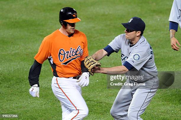 Ryan Langerhans of the Seattle Mariners tags out Matt Wieters of the Baltimore Orioles at Camden Yards on May 11, 2010 in Baltimore, Maryland.