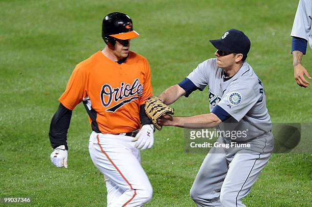 Ryan Langerhans of the Seattle Mariners tags out Matt Wieters of the Baltimore Orioles at Camden Yards on May 11, 2010 in Baltimore, Maryland.